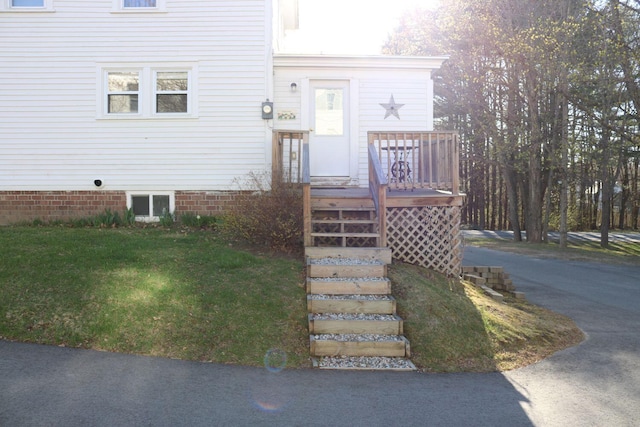 exterior space featuring a yard and a deck