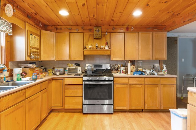 224 Branch Rd, Wells, ME 04090 - kitchen with stainless steel range with gas cooktop, a sink, light countertops, light wood finished floors, and recessed lighting