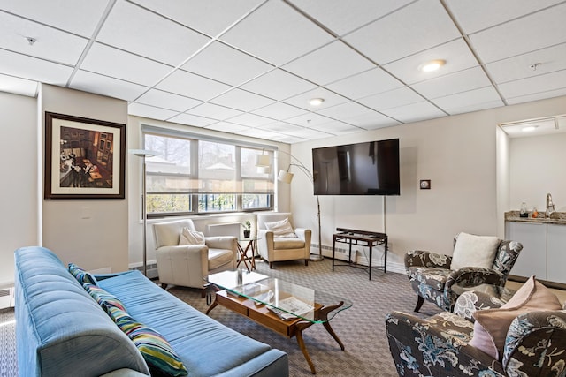 45 Eastern Promenade Unit 1E, Portland, ME 04101 - living area with carpet flooring, baseboard heating, baseboards, and a paneled ceiling