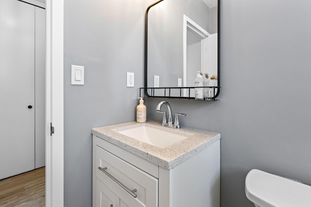 45 Eastern Promenade Unit 1E, Portland, ME 04101 - bathroom with toilet, wood finished floors, and vanity