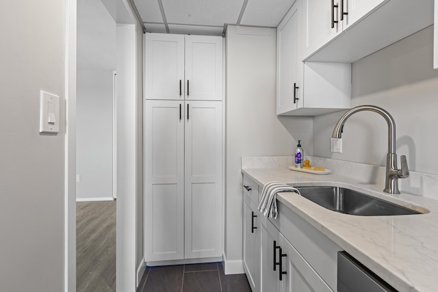 45 Eastern Promenade Unit 1E, Portland, ME 04101 - kitchen featuring light stone counters, a sink, and white cabinets