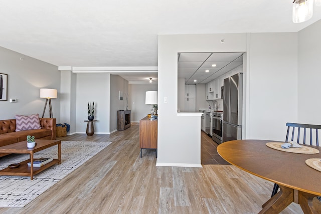 45 Eastern Promenade Unit 1E, Portland, ME 04101 - living area featuring baseboards, recessed lighting, and wood finished floors