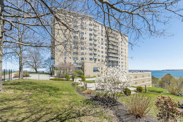 45 Eastern Promenade Unit 1E, Portland, ME 04101 - view of building exterior with a water view and fence