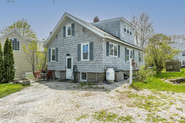 31 Church St, Yarmouth, ME 04096 - rear view of house featuring a chimney and a patio area