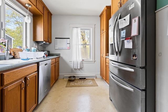 31 Church St, Yarmouth, ME 04096 - kitchen featuring stainless steel appliances, brown cabinets, and baseboards