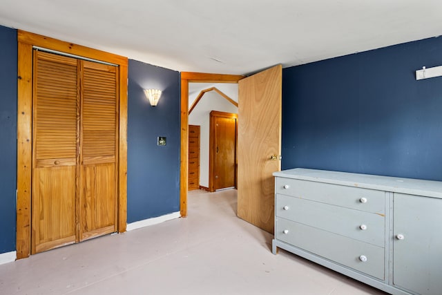 31 Church St, Yarmouth, ME 04096 - unfurnished bedroom featuring finished concrete flooring, baseboards, and a closet