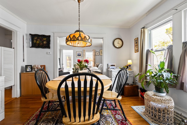 31 Church St, Yarmouth, ME 04096 - dining area featuring light wood-type flooring and crown molding