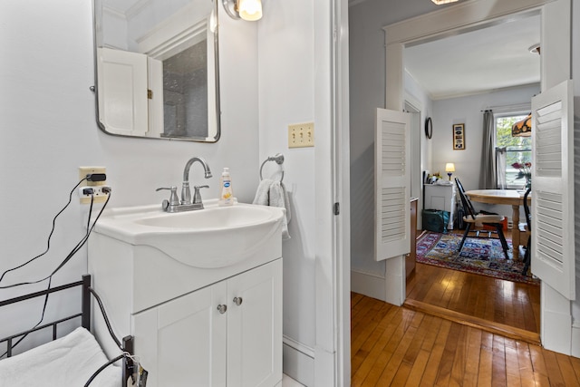 31 Church St, Yarmouth, ME 04096 - bathroom with wood-type flooring, vanity, baseboards, and crown molding