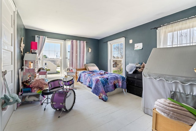 bedroom with multiple windows