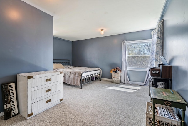 carpeted bedroom with baseboards