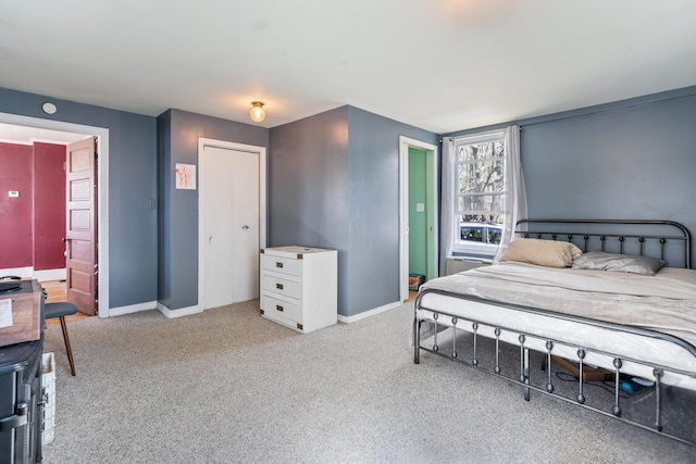 carpeted bedroom featuring baseboards