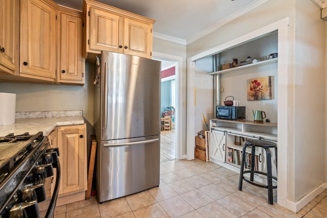 kitchen featuring ornamental molding, light tile patterned floors, light brown cabinetry, and black appliances