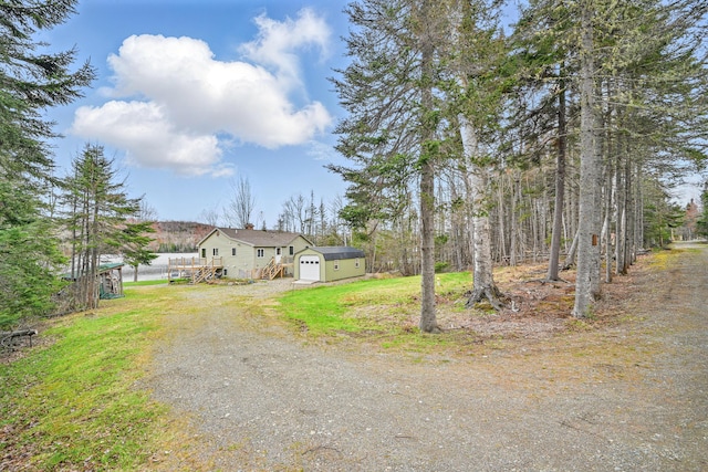 17 Kokadjo N Rd, Frenchtown Twp, ME 04441 - view of front of house with dirt driveway, a wooden deck, and a chimney