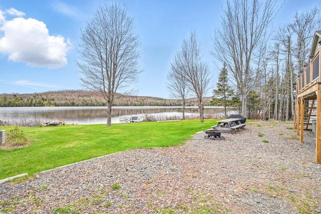 17 Kokadjo N Rd, Frenchtown Twp, ME 04441 - view of grassy yard with a water view and a fire pit
