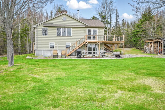 17 Kokadjo N Rd, Frenchtown Twp, ME 04441 - back of house with stairs, a wooden deck, a lawn, and roof with shingles