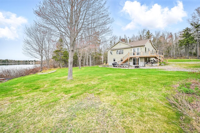 17 Kokadjo N Rd, Frenchtown Twp, ME 04441 - view of grassy yard featuring stairs and a deck with water view