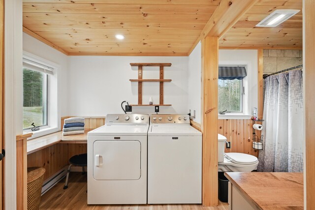 17 Kokadjo N Rd, Frenchtown Twp, ME 04441 - washroom with a baseboard heating unit, wooden ceiling, washer and clothes dryer, a wainscoted wall, and wooden walls