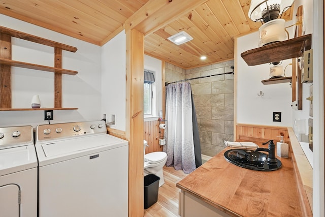 17 Kokadjo N Rd, Frenchtown Twp, ME 04441 - full bathroom with wooden ceiling, a sink, separate washer and dryer, toilet, and wood finished floors