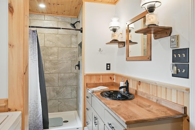 17 Kokadjo N Rd, Frenchtown Twp, ME 04441 - bathroom with a stall shower, wood ceiling, a wainscoted wall, and vanity