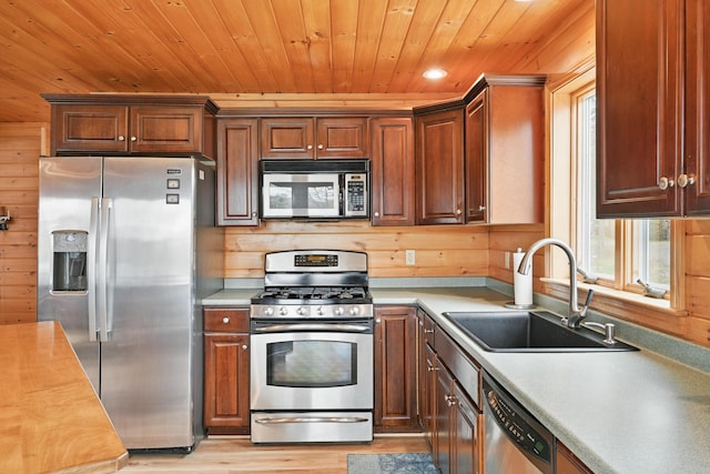 17 Kokadjo N Rd, Frenchtown Twp, ME 04441 - kitchen with appliances with stainless steel finishes, a sink, light countertops, wood ceiling, and light wood-style floors