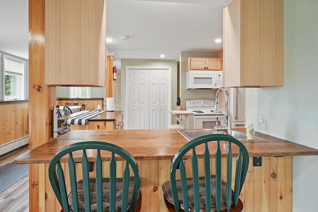 17 Kokadjo N Rd, Frenchtown Twp, ME 04441 - kitchen featuring white appliances, light brown cabinetry, a sink, recessed lighting, and wood finished floors
