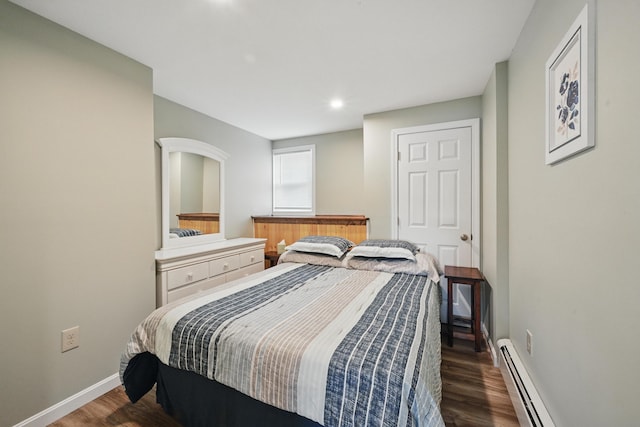 17 Kokadjo N Rd, Frenchtown Twp, ME 04441 - bedroom featuring a baseboard heating unit, dark wood finished floors, baseboards, and recessed lighting