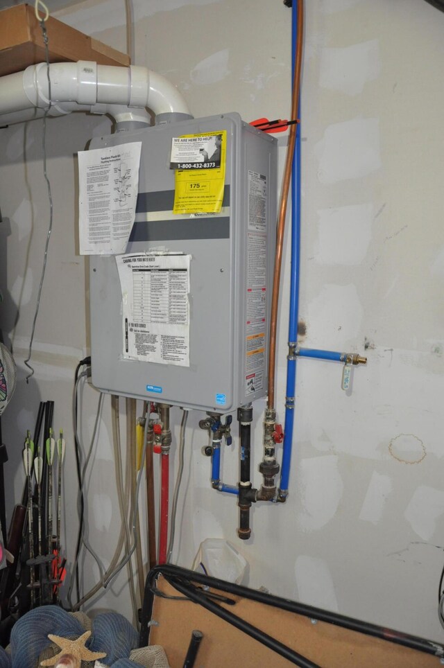 utility room with water heater