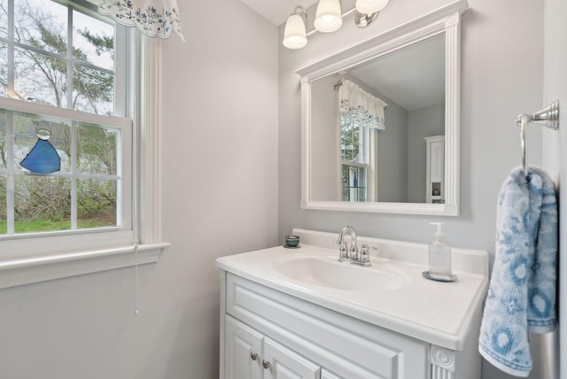 66 Colonial Vlg Unit 66, Falmouth, ME 04105 - bathroom featuring vanity and a healthy amount of sunlight
