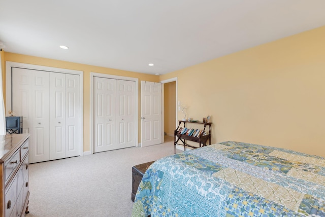 66 Colonial Vlg Unit 66, Falmouth, ME 04105 - bedroom with carpet flooring, baseboards, multiple closets, and recessed lighting
