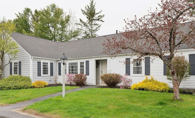 66 Colonial Vlg Unit 66, Falmouth, ME 04105 - ranch-style home with a shingled roof and a front lawn