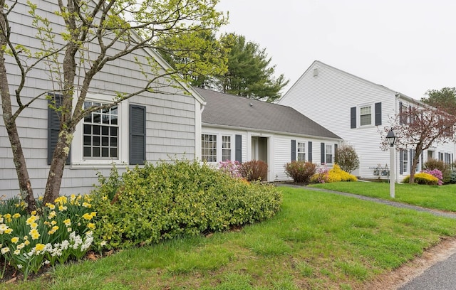 66 Colonial Vlg Unit 66, Falmouth, ME 04105 - view of front of house featuring a front lawn