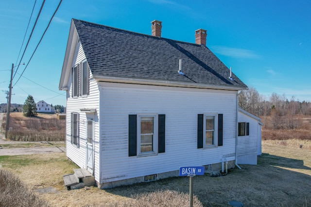 1357 Indian River Rd, Addison, ME 04606 - view of side of property featuring a chimney and roof with shingles