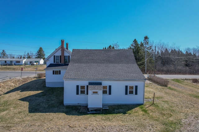 1357 Indian River Rd, Addison, ME 04606 - view of side of property with a yard and roof with shingles