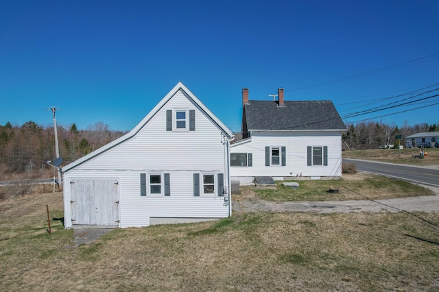 1357 Indian River Rd, Addison, ME 04606 - back of house featuring a lawn and a chimney