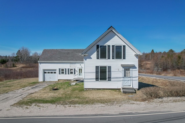 1357 Indian River Rd, Addison, ME 04606 - view of front of home with concrete driveway, an attached garage, and roof with shingles