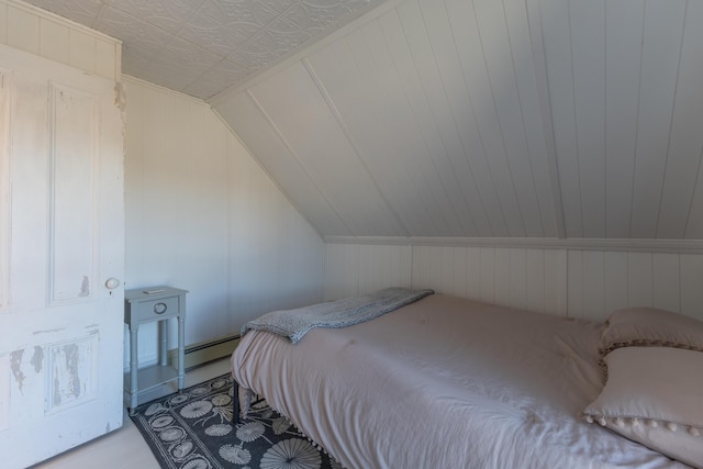 1357 Indian River Rd, Addison, ME 04606 - bedroom featuring wood finished floors, a baseboard radiator, and lofted ceiling
