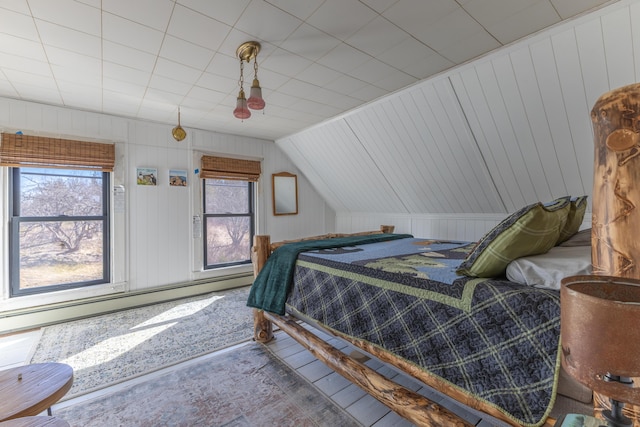 1357 Indian River Rd, Addison, ME 04606 - bedroom with multiple windows, baseboard heating, vaulted ceiling, and wooden walls