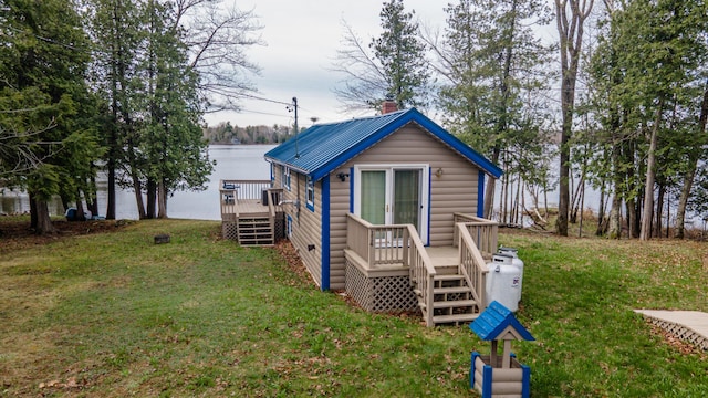 114 Smith Rd, Hudson, ME 04449 - view of outbuilding featuring stairway and a water view
