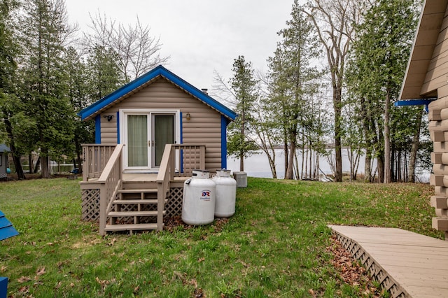 114 Smith Rd, Hudson, ME 04449 - view of property exterior featuring a deck, central AC unit, and a yard