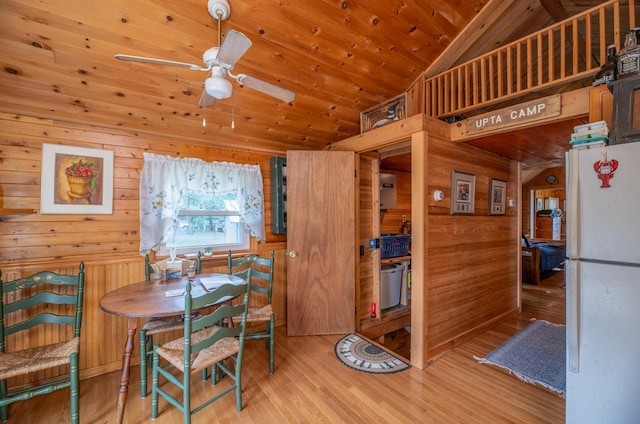 114 Smith Rd, Hudson, ME 04449 - dining space with wood walls, wood finished floors, wooden ceiling, ceiling fan, and high vaulted ceiling