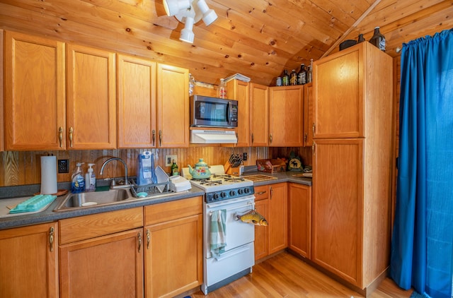 114 Smith Rd, Hudson, ME 04449 - kitchen with white range with gas cooktop, lofted ceiling, light wood-style floors, a sink, and under cabinet range hood