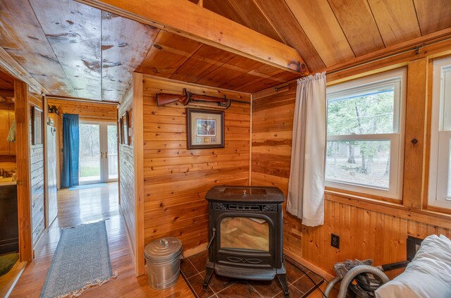 114 Smith Rd, Hudson, ME 04449 - interior space with wood ceiling, healthy amount of natural light, wood walls, a wood stove, and wood finished floors