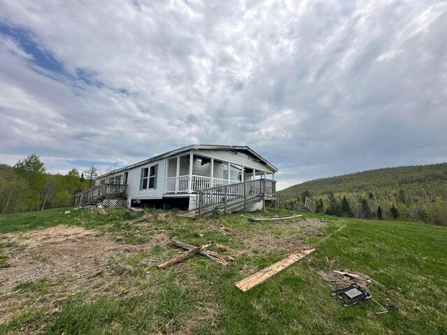 153 Spaulding Lake Rd, Oakfield, ME 04763 - view of side of property featuring a forest view