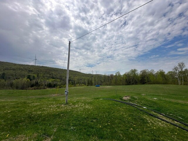 153 Spaulding Lake Rd, Oakfield, ME 04763 - view of yard with a rural view and a wooded view