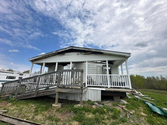 153 Spaulding Lake Rd, Oakfield, ME 04763 - back of property with a porch