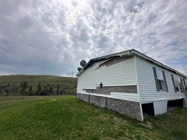 153 Spaulding Lake Rd, Oakfield, ME 04763 - view of side of property featuring a yard