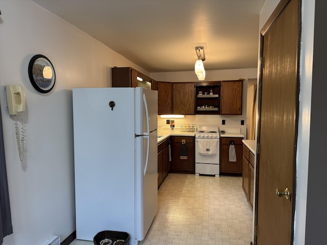3043 W Chapman Rd, Mapleton, ME 04757 - kitchen featuring open shelves, light floors, white appliances, and light countertops