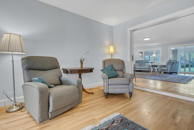 sitting room featuring wood finished floors and baseboards