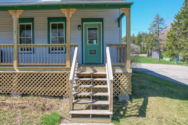 doorway to property featuring covered porch