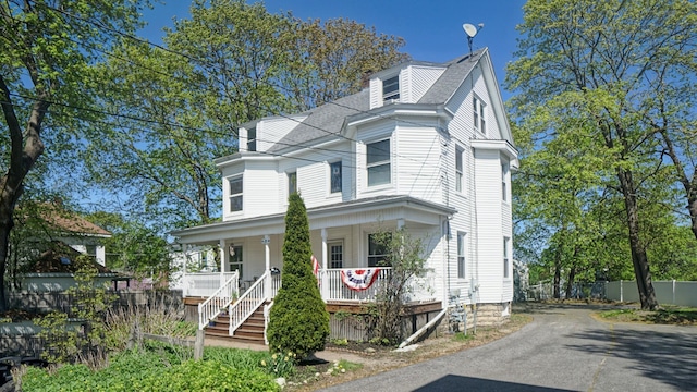 25 Nevens St Unit 1, Portland, ME 04103 - view of front of house featuring a porch, driveway, stairway, and fence